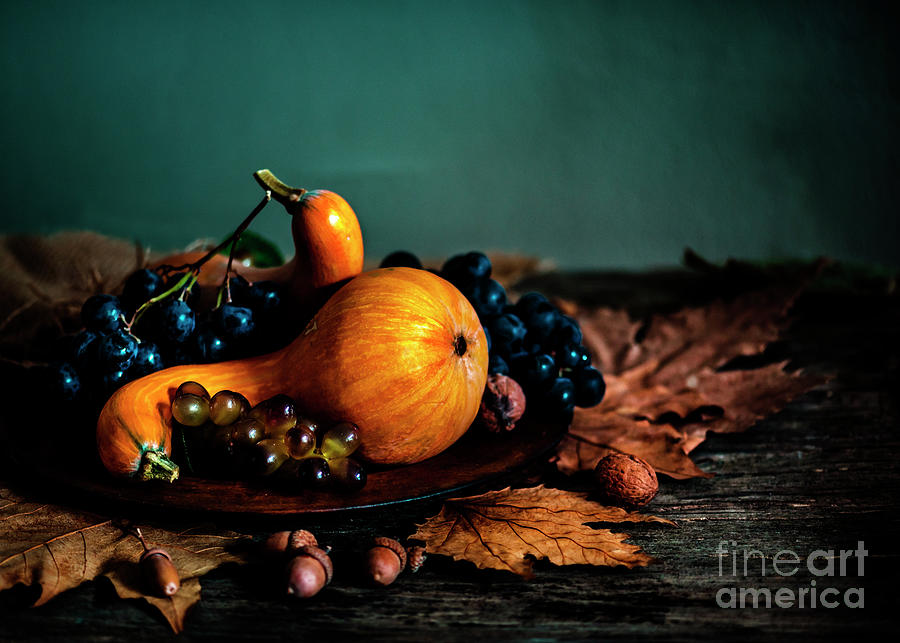 Thanksgiving composition with autumn fruit in wooden plate Photograph by Jelena Jovanovic