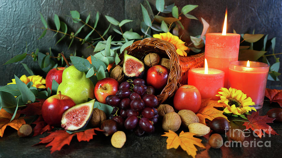 Thanksgiving cornucopia table setting centerpiece close up. Photograph by Milleflore Images