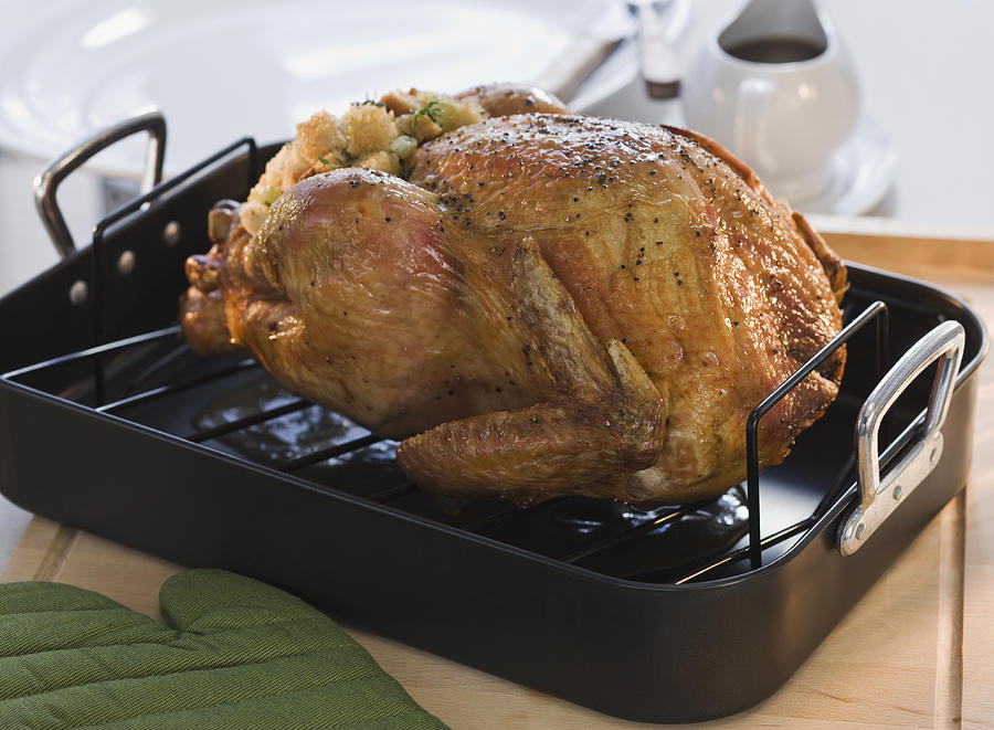 Thanksgiving turkey in roasting pan Photograph by Tetra Images