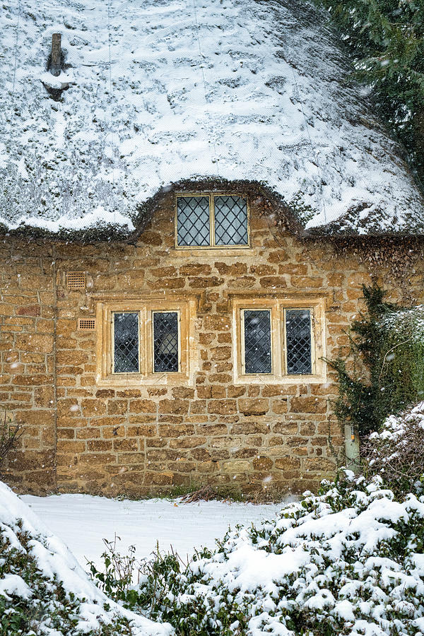 Thatched Stone Cottage in the Winter Snow Photograph by Tim Gainey
