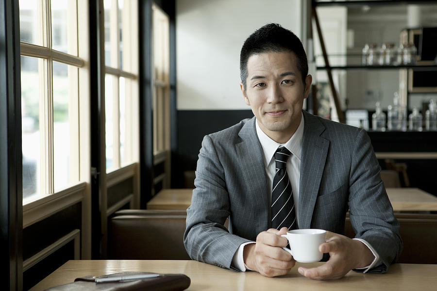 The 30th generation male businessman who drinks coffee Photograph by Indeed