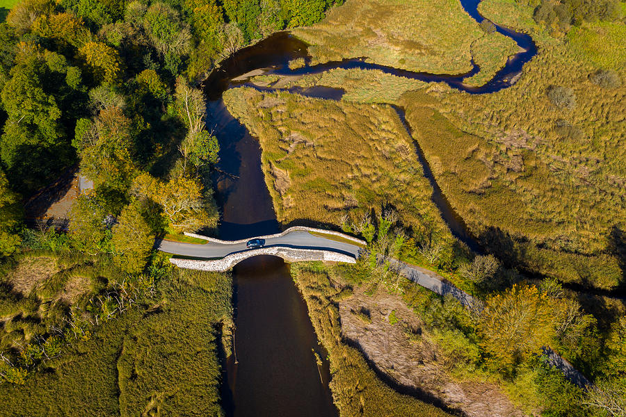 The aerial view from a drone of an old stone bridge in Dumfries and Galloway south west Scotland Photograph by JohnFScott