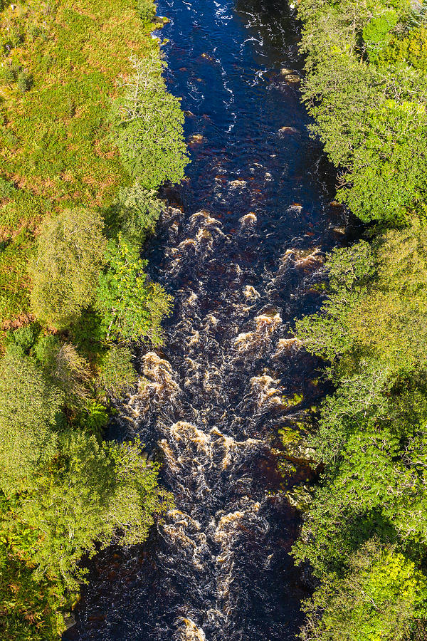 The aerial view looking straight down at a river in remote rural Dumfries and Galloway Photograph by JohnFScott