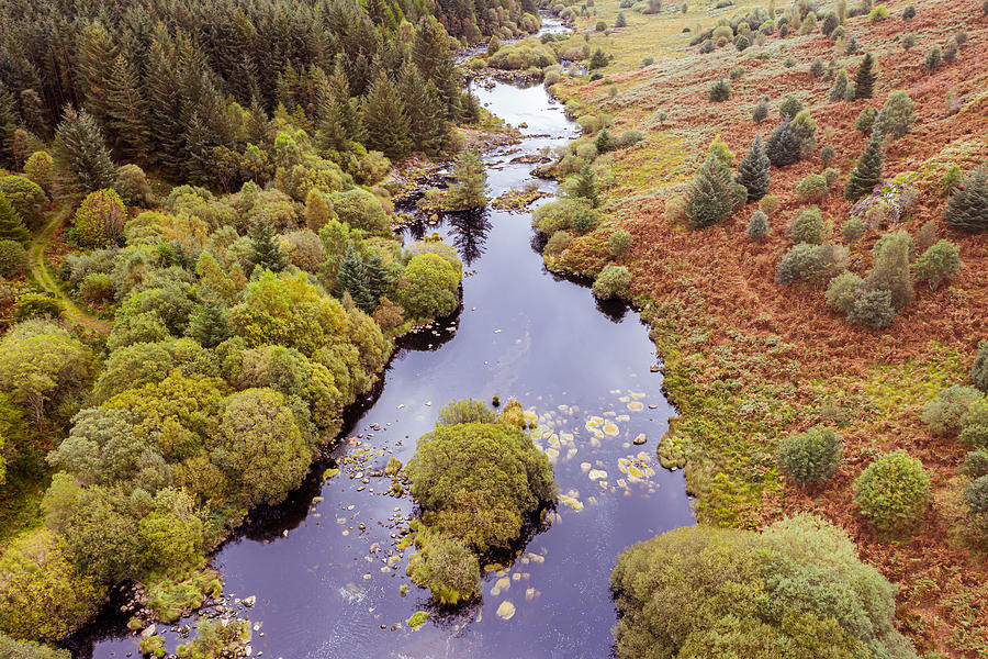 The aerial view of a river flowing through an area of rural Scotland Photograph by JohnFScott