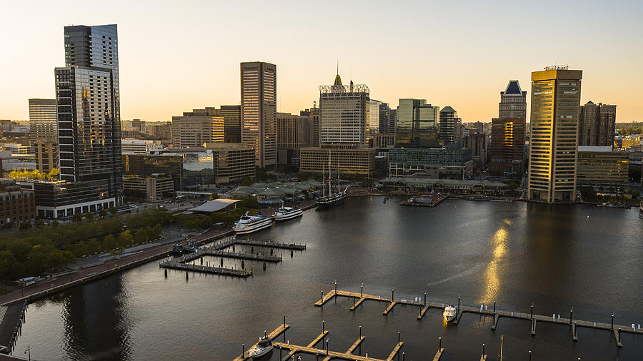 The aerial view of the Inner Harbor on Patapsco River in Baltimore, Maryland, USA, at sunset. Photograph by Alex Potemkin