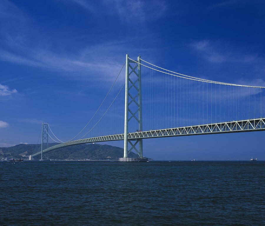The Akashi-Kaikyo Bridge in Kobe, Japan Photograph by GYRO PHOTOGRAPHY/amanaimagesRF