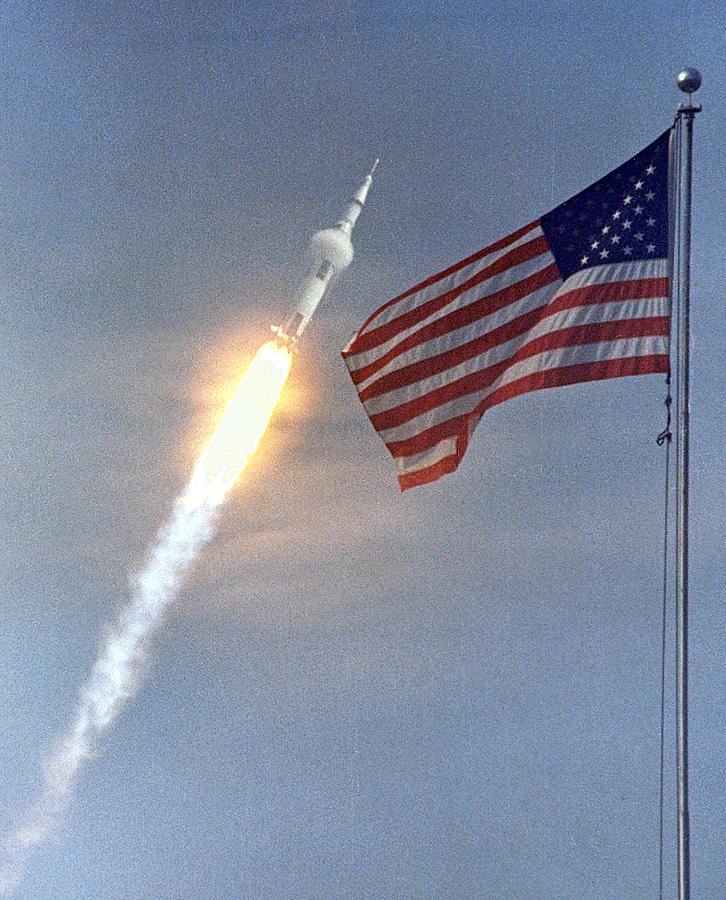 Vintage Painting - The American Flag heralds the flight of Apollo 11 mans first lunar landing mission by Les Classics