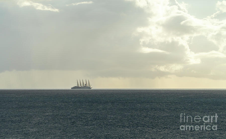 The automated five-masted cruise ship Club Med 2 sails off the C Photograph by William Kuta