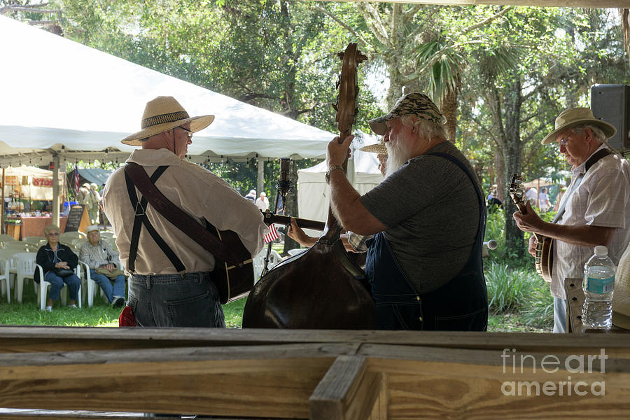 The Barefoot Mailmen bluegrass band performs at the Old Florida  Photograph by William Kuta