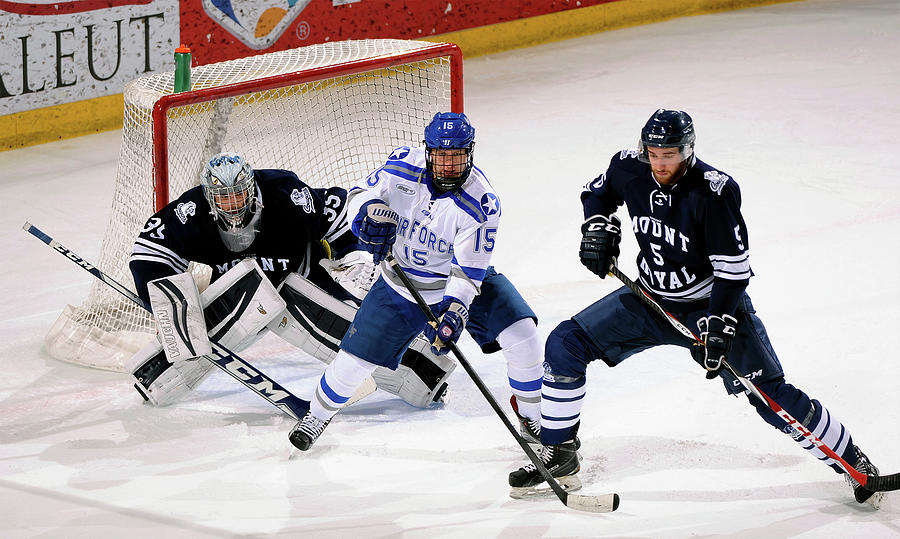 Air Force Academy Photograph - The Battle for the Puck by USAF Jason Guitierrez