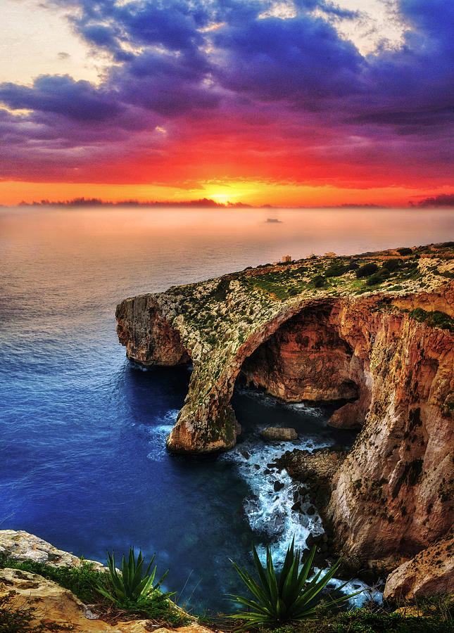 The Blue Grotto natural arch at sunrise - Landscape photo Photograph by Stephan Grixti