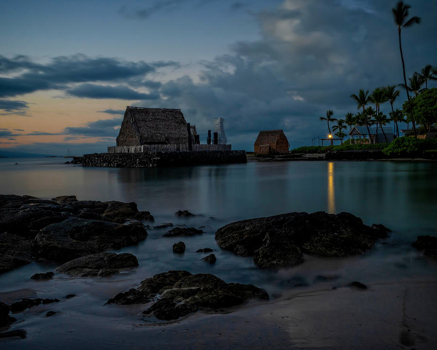 The blue hour before sunrise and all is calm on the lagoon of a tropical island. Photograph by Photo by James Keith