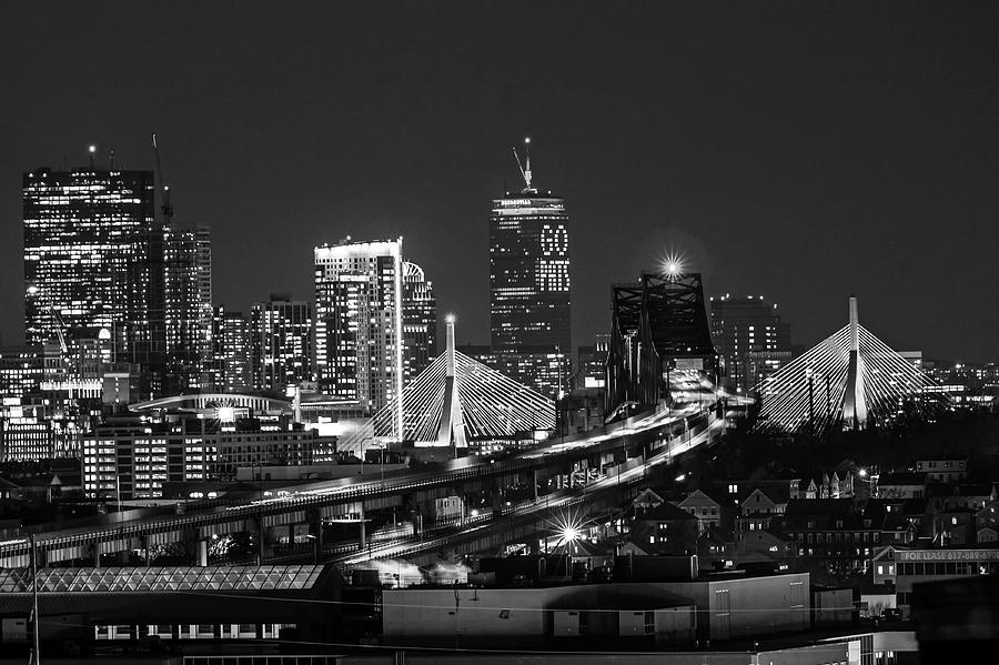 The Boston Skyline lit up for the New England Patriots Boston MA Black and White Photograph by Toby McGuire