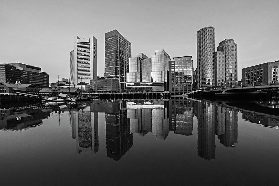 The Boston Skyline reflecting in Fort Point Channel Morning Golden Glow Black and White Photograph by Toby McGuire