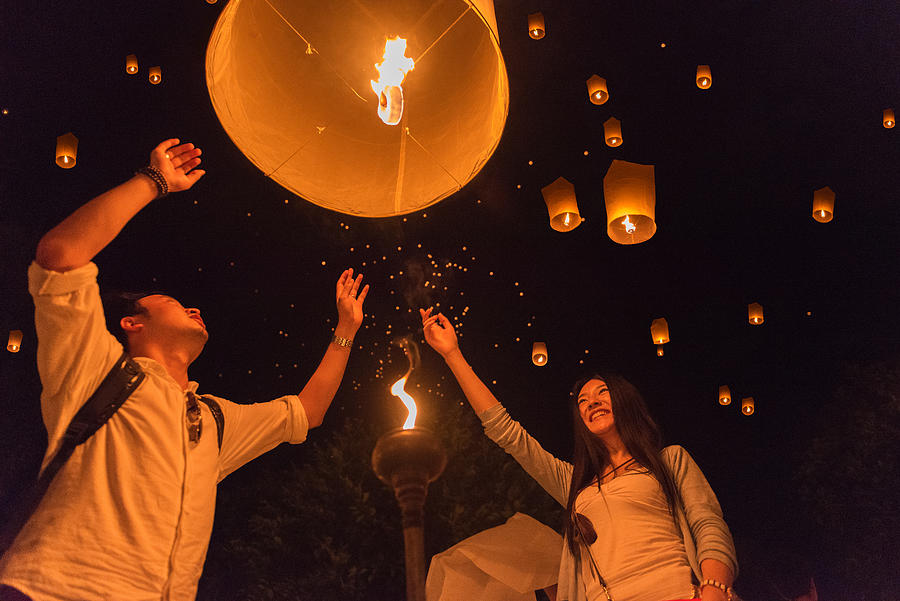 The Chinese foreign tourists  made lantern in Yi peng Festival, Chiangmai, Thailand. Photograph by Aumphotography