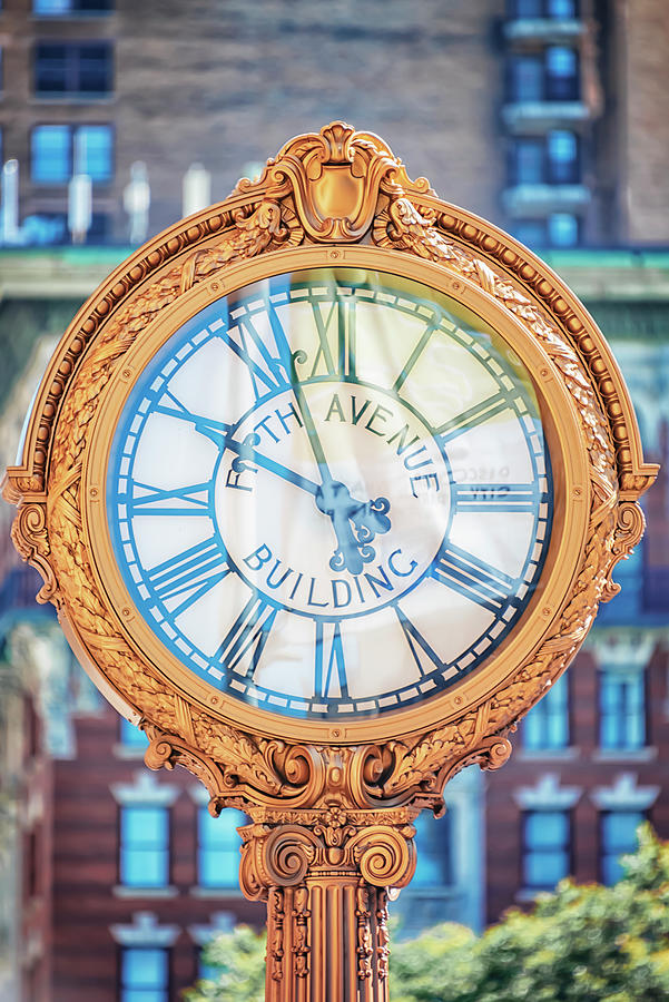 Architecture Photograph - The clock on Fifth Avenue by Manjik Pictures