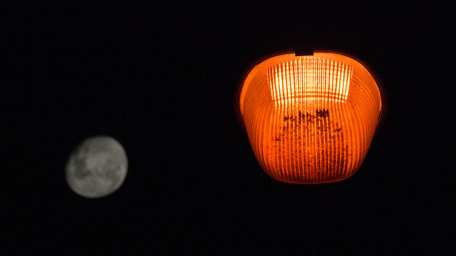 The contrast of public lighting with the full moon Photograph by CRMacedonio