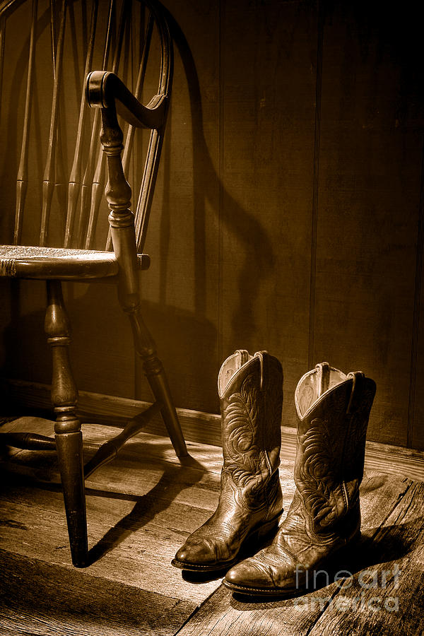 The Cowgirl Boots and the Old Chair - Sepia Photograph by Olivier Le Queinec