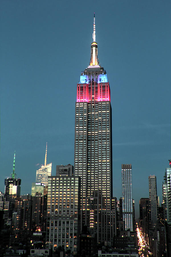 The Empire State with red blue NYC landmark Photograph by Habib Ayat