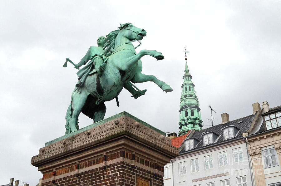 Equestrian Statue Of Absalon, the Founder Of The Danish City Of Copenhagen. The Steeple of the Ni Photograph by Tom Wurl