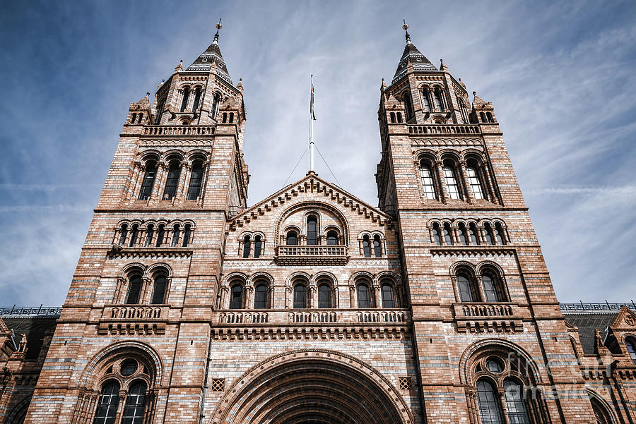The exterior of the Natural History Museum, London, showing the original building against a blue sky Photograph by Jane Rix