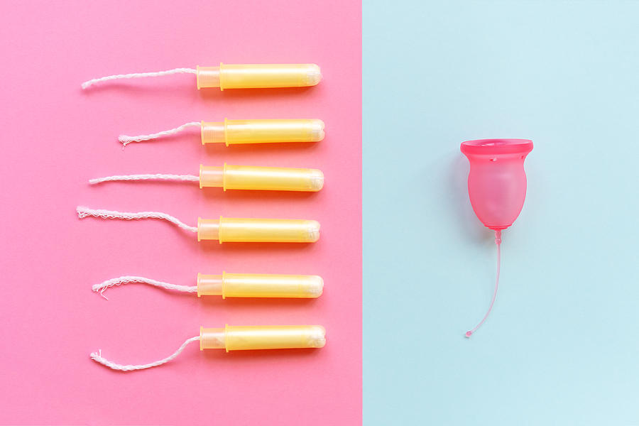 The female menstrual cup is contrasted with six tampons in the applicators. Photograph by Svetlana Ivanova