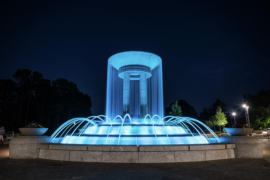 The Fountain Lit Up Blue in Downtown Cary Photograph by Anthony Doudt