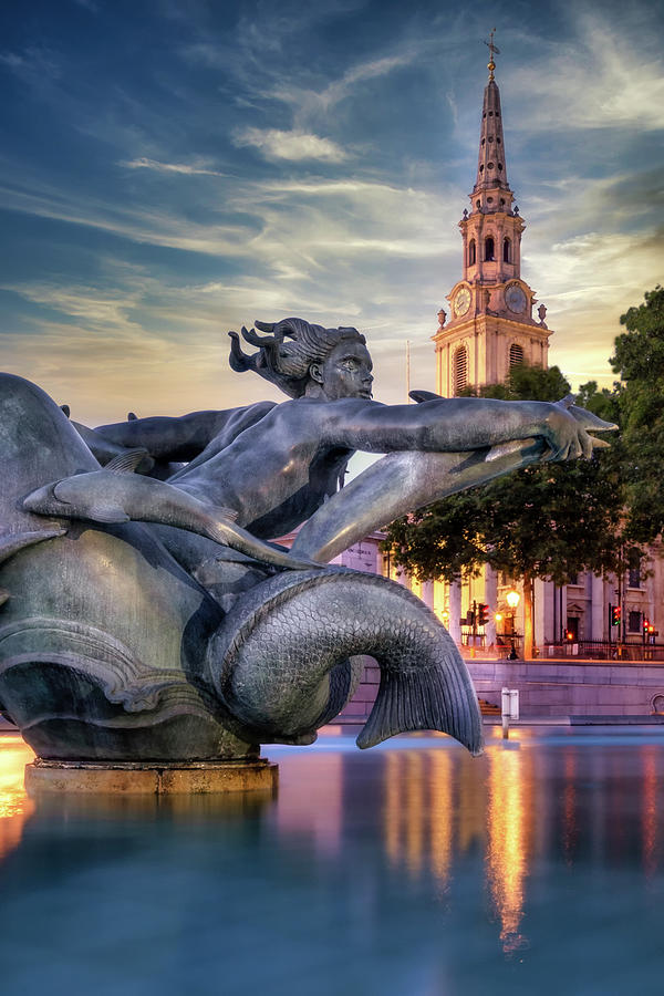 The fountains on Trafalgar Square in London at sunset Photograph by Karel Miragaya