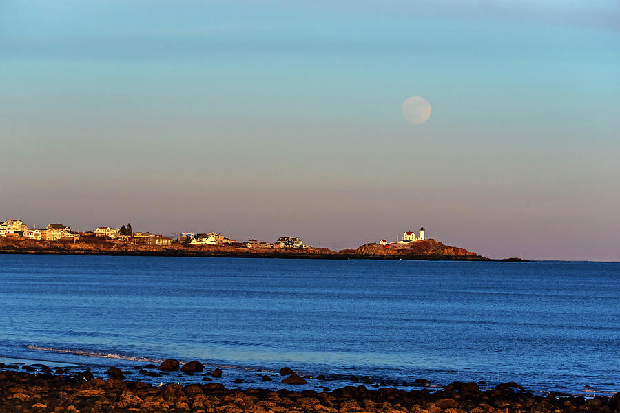 The full moon rises over the Nubble Lighthouse York Beach Cape Neddick ME Photograph by Toby McGuire
