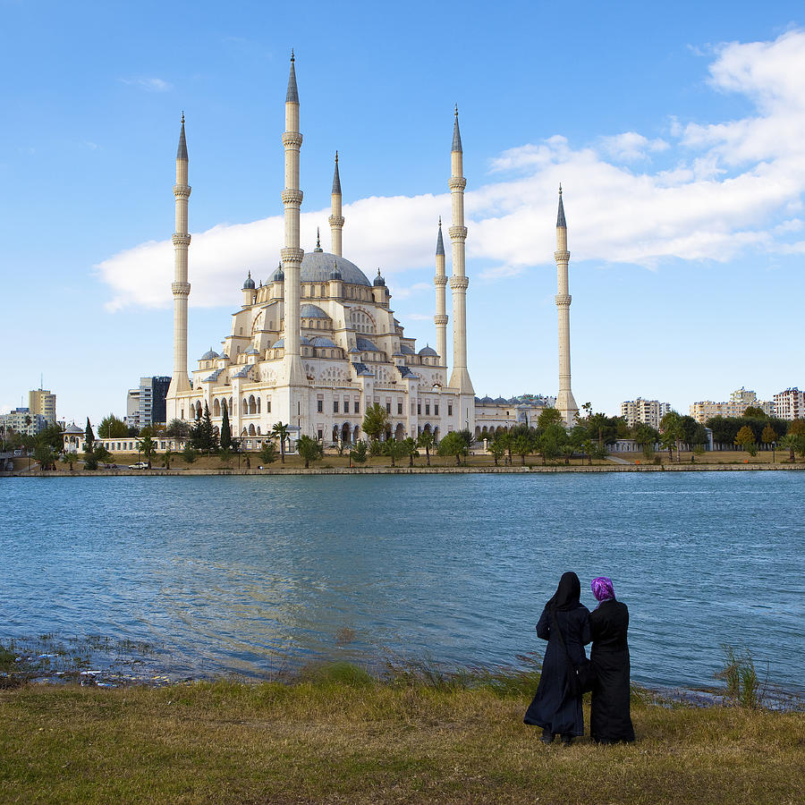 The girls and the mosque Photograph by Ozgur Donmaz