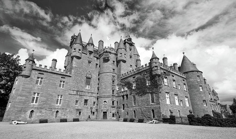 The Glamis Castle in Scotland. Black and white cloudy sky Photograph by Michalakis Ppalis