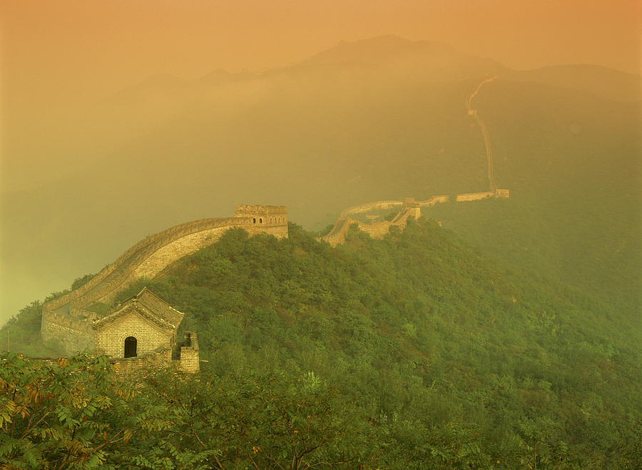 The Great Wall Of China With A Warm Yellow Sky Photograph by Rubberball