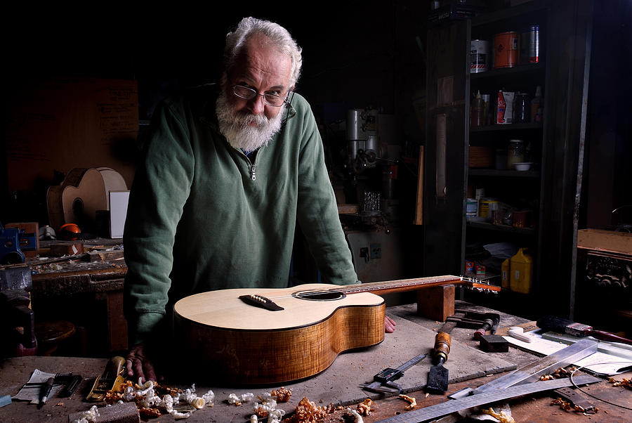The Guitar Maker with finished guitar Photograph by John Clutterbuck