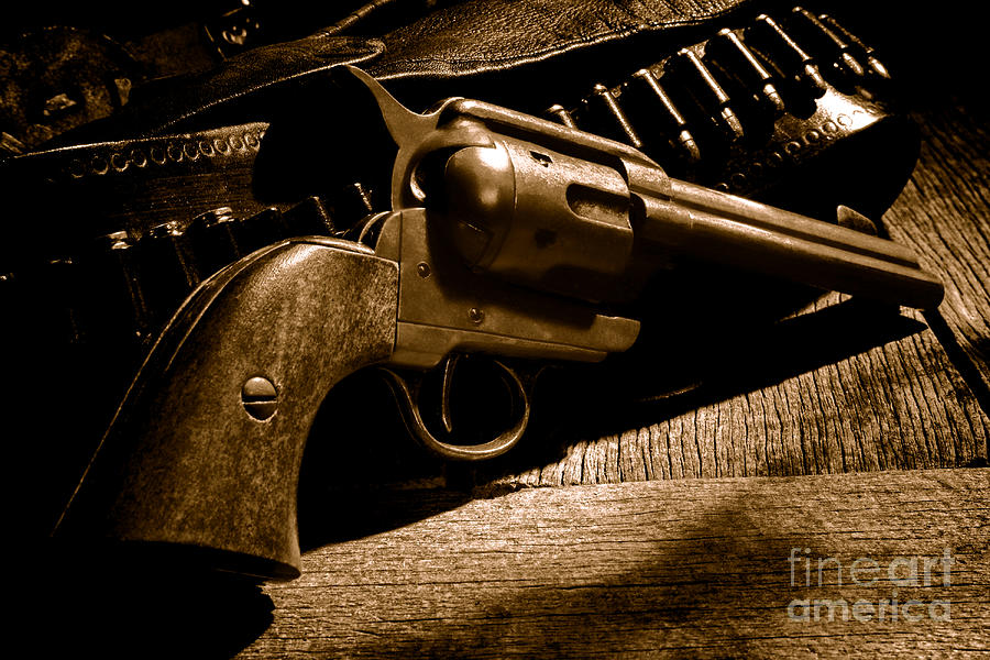 The Gun that Won the West - Sepia Photograph by Olivier Le Queinec