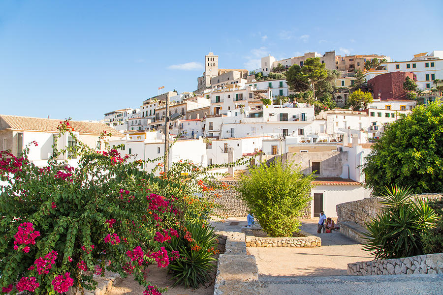 The Ibiza old town with flowers on summertime. Photograph by Artur Debat