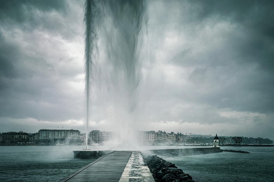 The Jet dEau fountain in Geneva on a stormy day Photograph by Benoit Bruchez