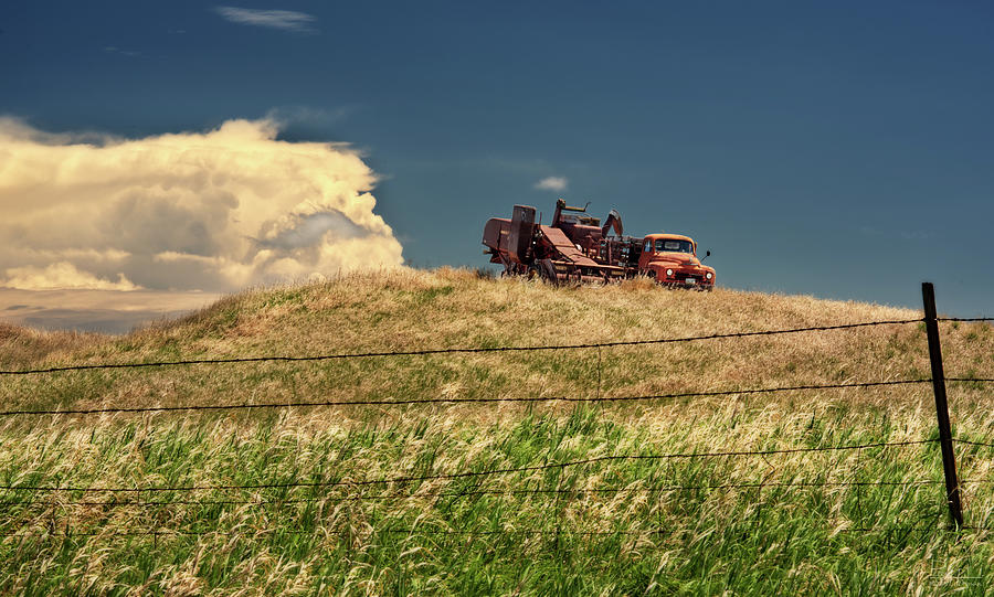 The Last Harvest - Massey Harris combine and International truck on ND pasture hill Photograph by Peter Herman
