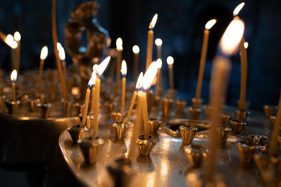 The light on candles in the church with the dark tone of background for praying to the God Photograph by Chain45154