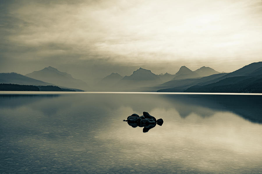 The Majestic Beauty Of Lake McDonald In Glacier National Park In Sepia Photograph by Gregory Ballos