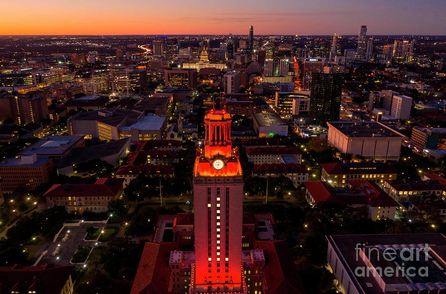 Austin Photograph - The majestic UT Tower glows Orange with No. 1 overlooking the Texas Capitol downtown Austin Skyline by Dan Herron