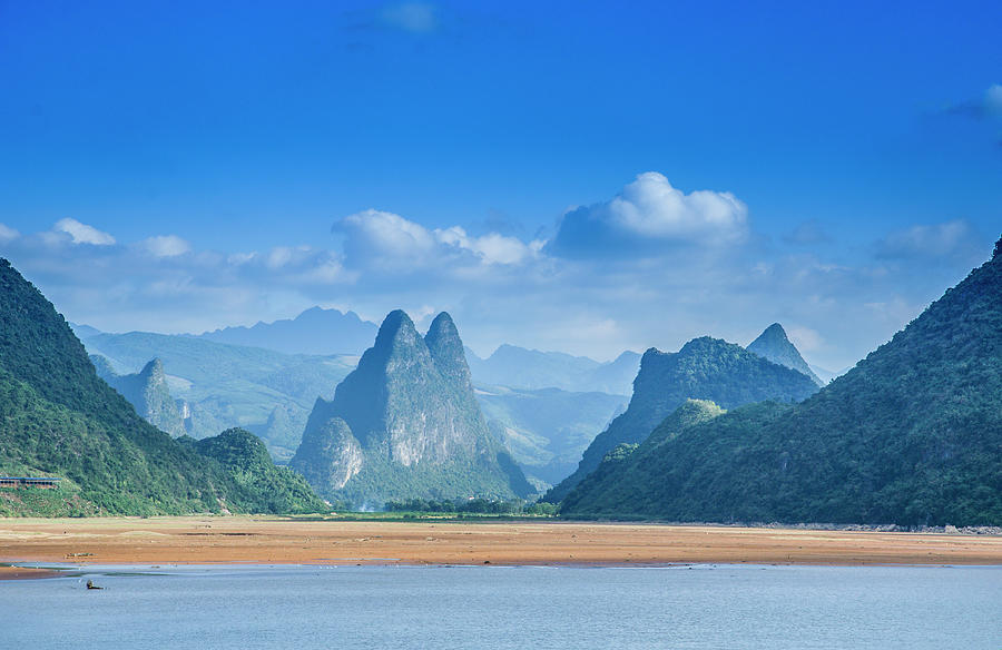 The mountain and river scenery with blue sky, Guilin, China. Photograph by Carl Ning