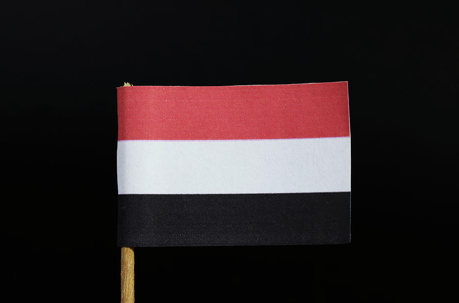 The national flag of Yemen on toothpick on black background. A horizontal tricolour of red, white and black Photograph by Vaclav Sonnek