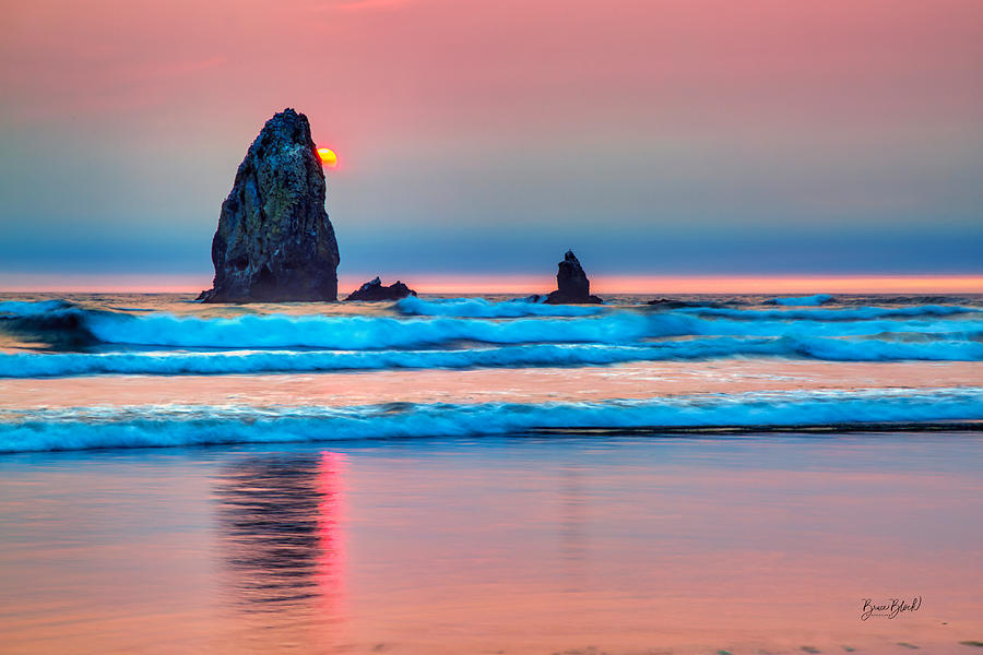 The needles rock formation at cannon beach at sunset Photograph by Bruce Block