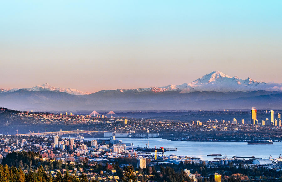 The North Vancouver skyline and ships in the harbour and snow mountains visible in the background Photograph by Chinaface