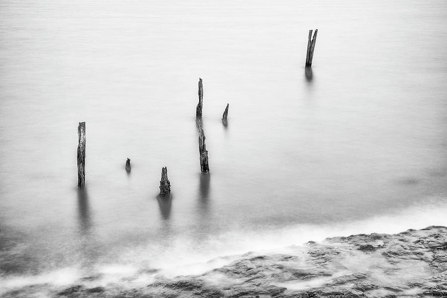 The Old Posts and the Rocks - Monochrome Photograph by John Paul Cullen
