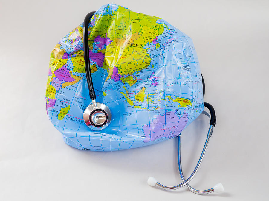 The planet earth and a stethoscope Photograph by Ana Maria Serrano