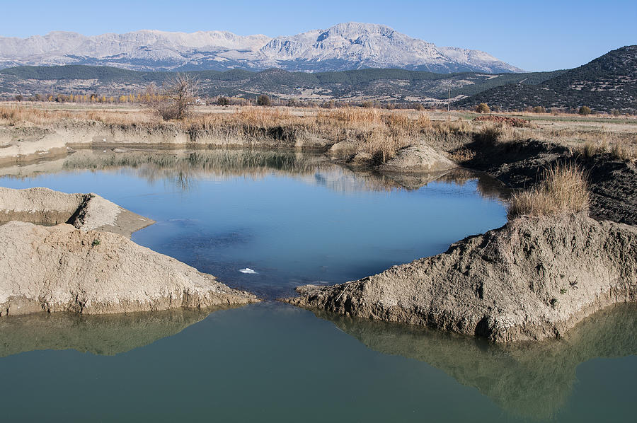 The pond formed in excavations - soil loss Photograph by Fotosuper