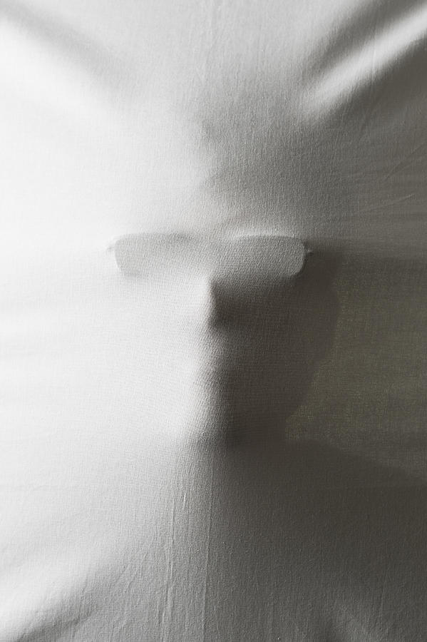 The portrait of the man over a white sheet Photograph by Yagi Studio