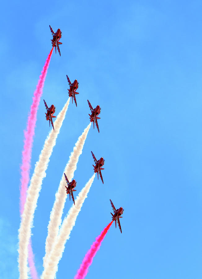 The Red Arrows Display Team and blue sky and smoke Photograph by Charlesy