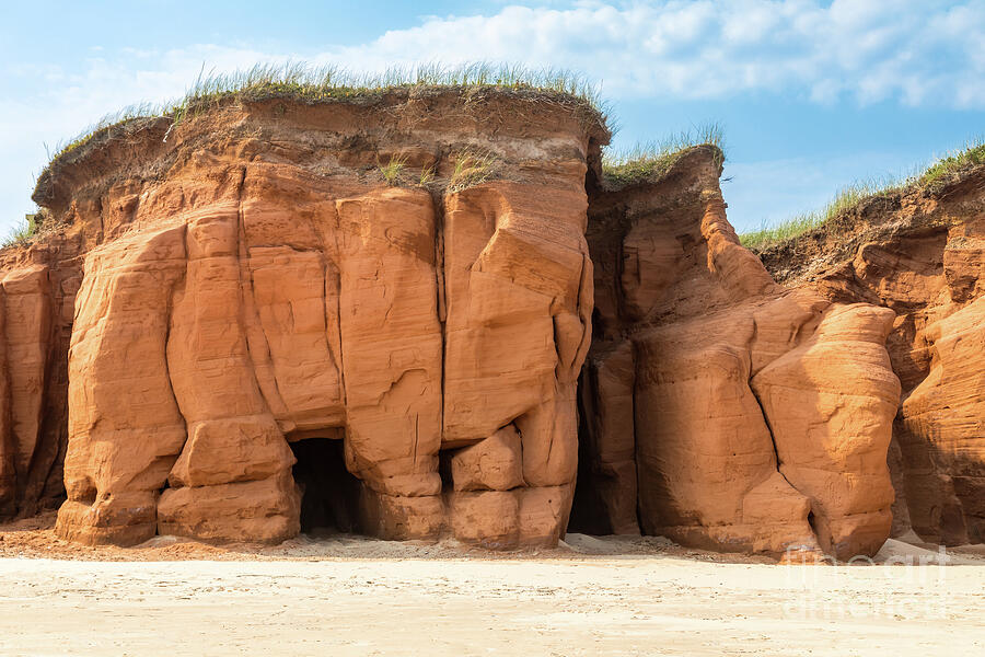 Summer Photograph - The red cliffs and beach of Havre aux Maisons, on the Gulf of St Lawrence, Magdalen Islands, Canada. Blue sky background. by Jane Rix